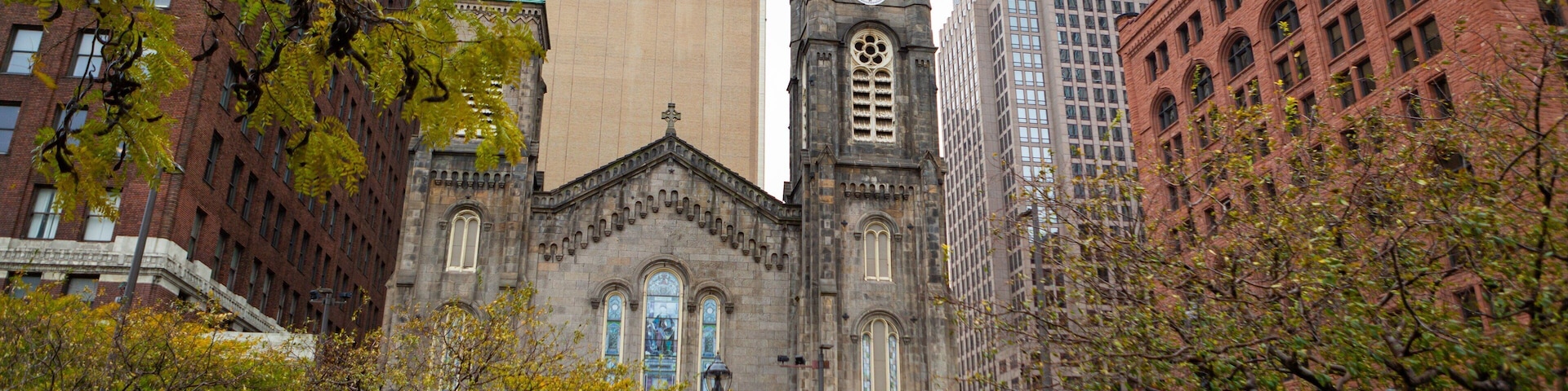 Old Stone Church which includes heritage architecture, a church or cathedral and a city