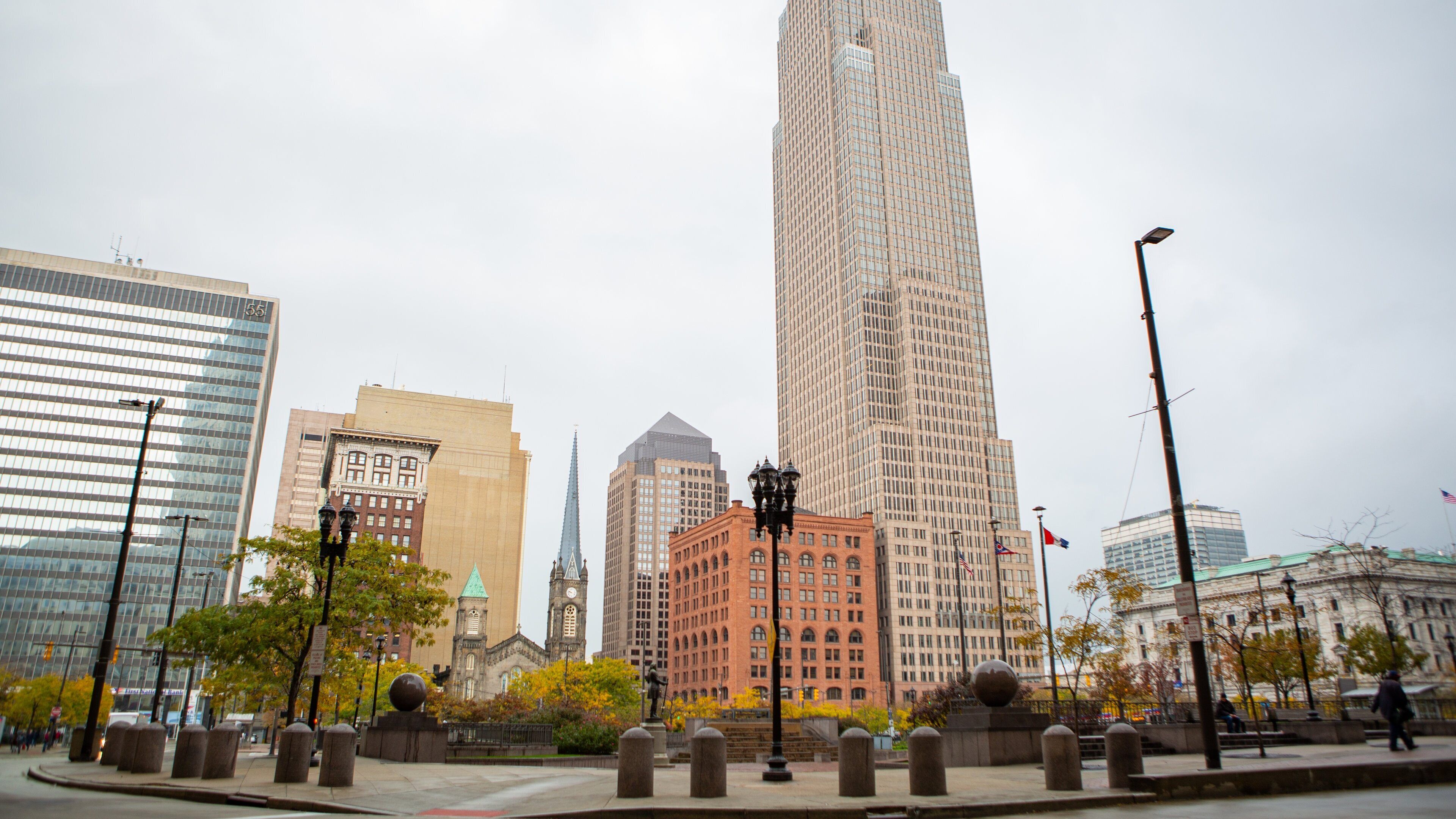 Old Stone Church which includes a high rise building and a city
