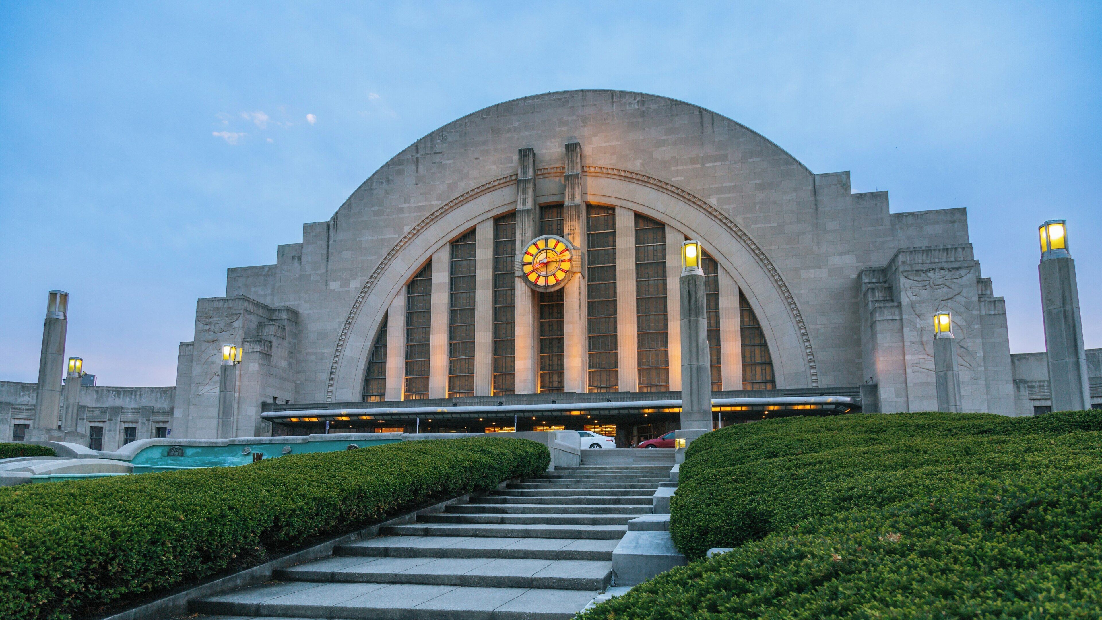 Cincinnati Museum Center at Union Terminal welcomes visitors with its stunning Art Deco architecture during twilight hours