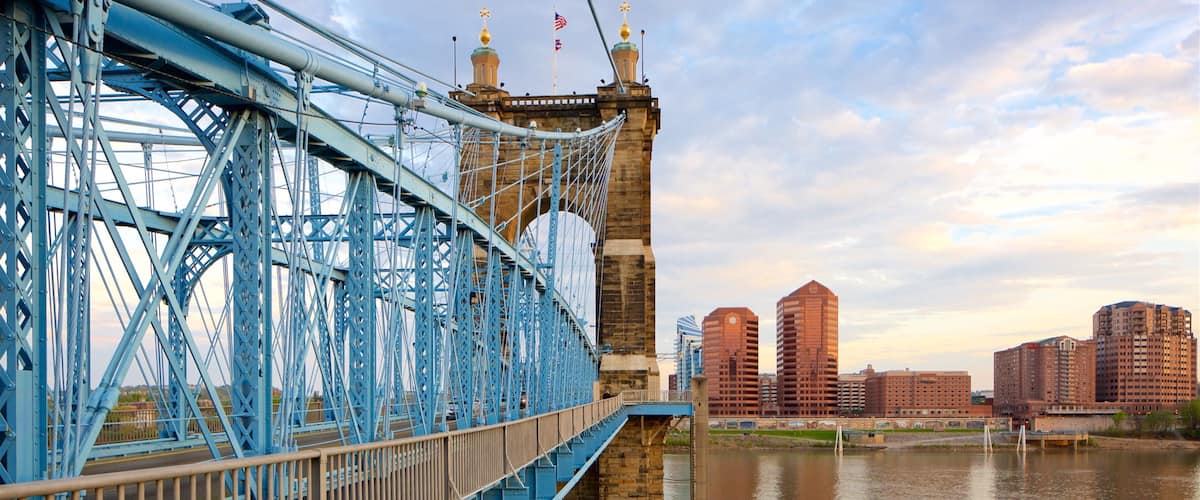 John A. Roebling Suspension Bridge showing a river or creek, heritage elements and a sunset