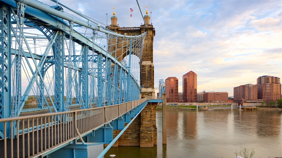 John A. Roebling Suspension Bridge showing a river or creek, heritage elements and a sunset