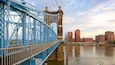 John A. Roebling Suspension Bridge showing a river or creek, heritage elements and a sunset