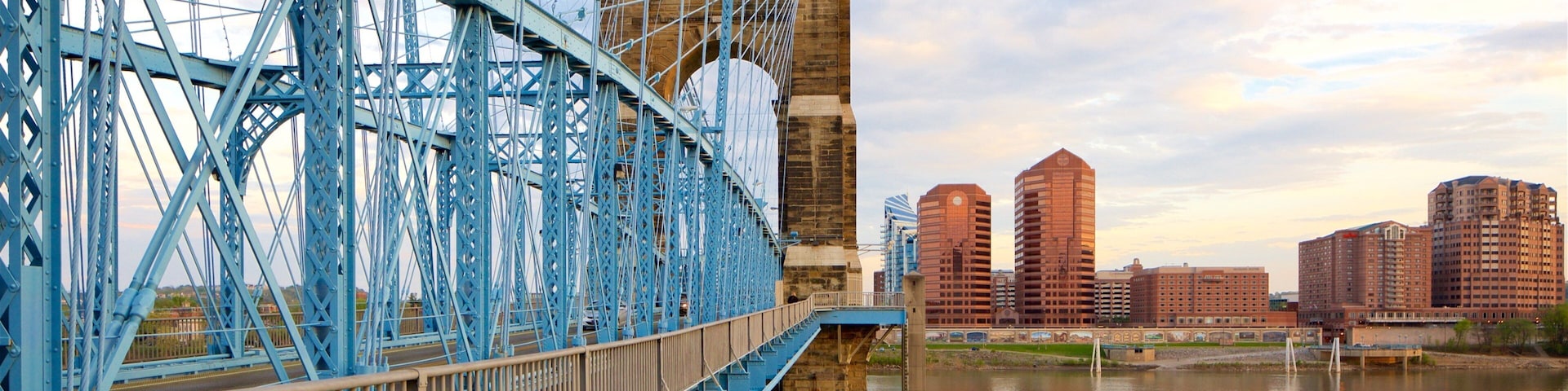 John A. Roebling Suspension Bridge showing a river or creek, heritage elements and a sunset