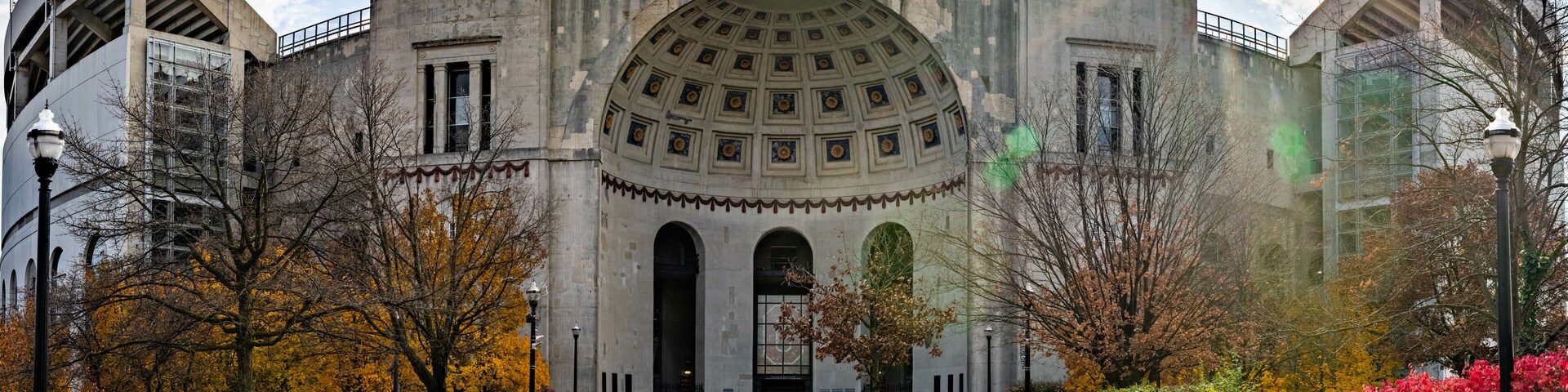 Historic Ohio Stadium with rotunda entrance against a cloudy sky in Columbus USA