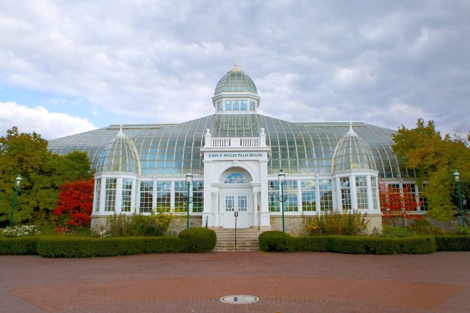 The John E. Wolfe Palm House with a glass dome and a white entrance.