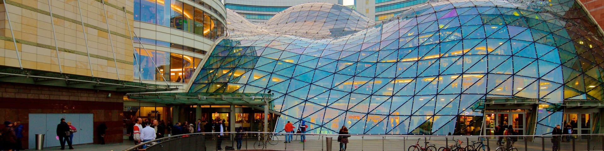 Zlote Tarasy which includes modern architecture and a city