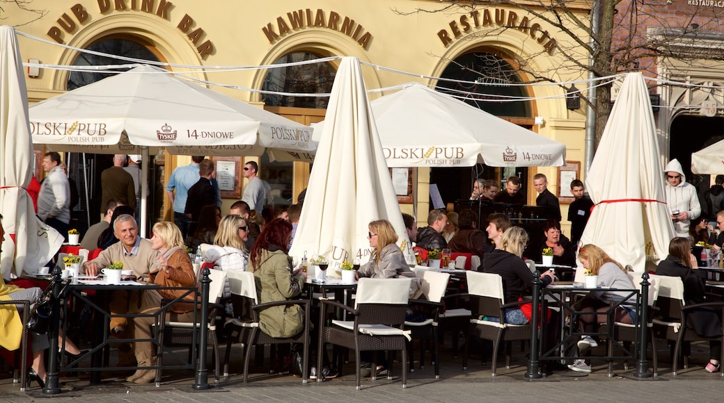 Main Market Square featuring outdoor eating as well as a small group of people