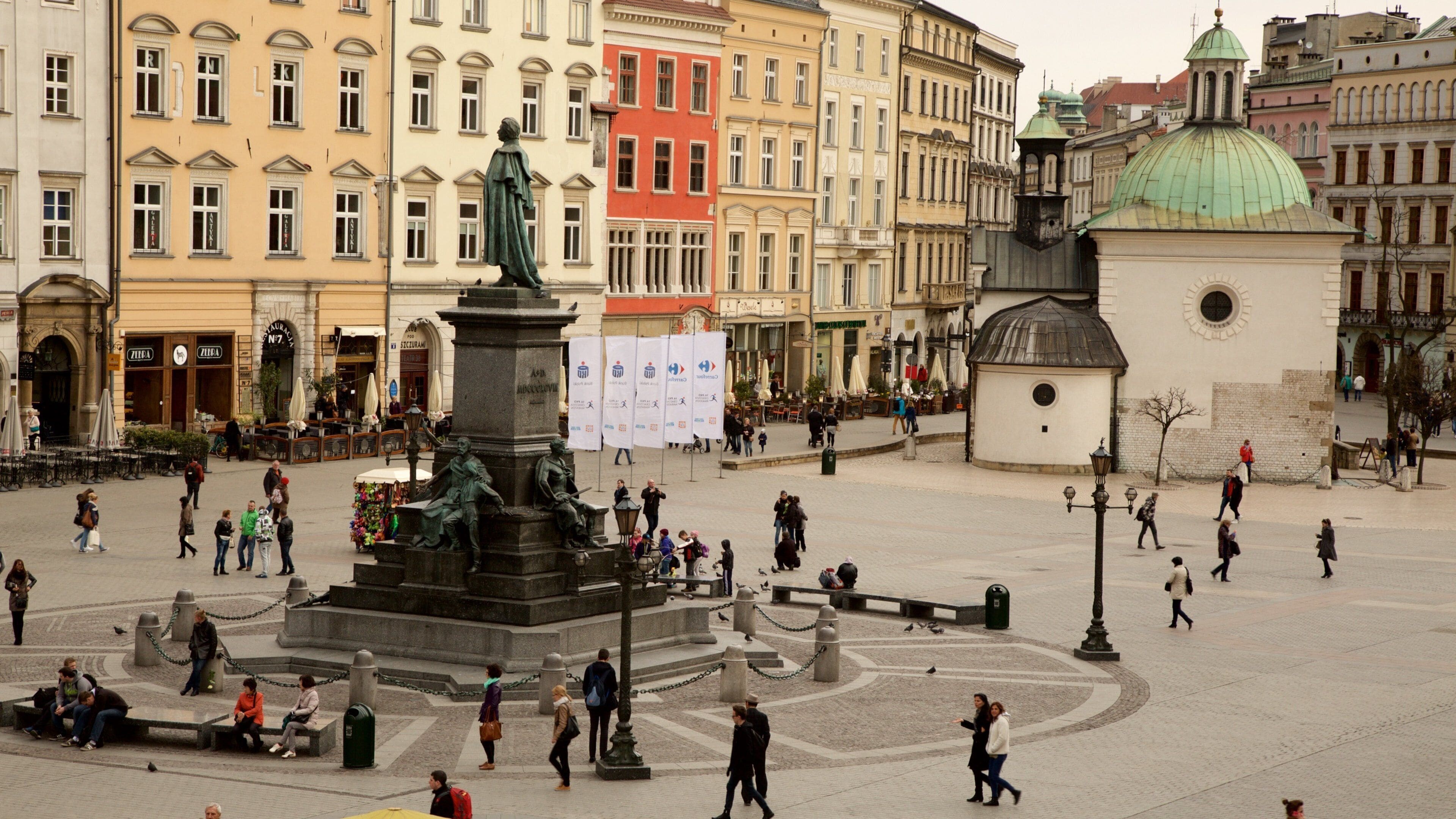 Main Market Square showing street scenes, a statue or sculpture and a square or plaza