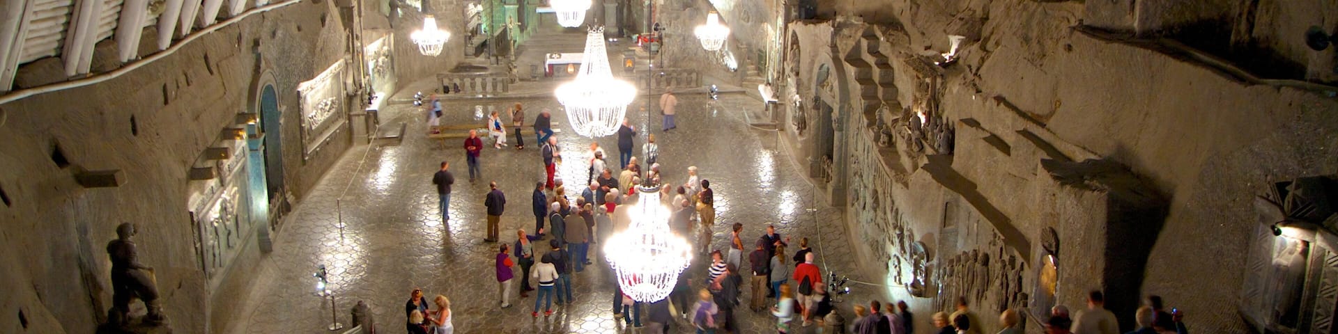 Wieliczka Salt Mine featuring heritage architecture and interior views as well as a large group of people