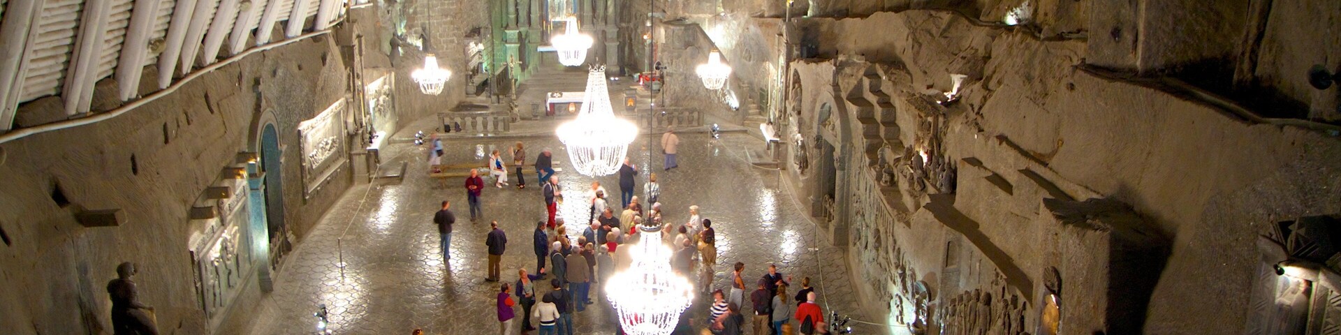 Wieliczka Salt Mine featuring heritage architecture and interior views as well as a large group of people