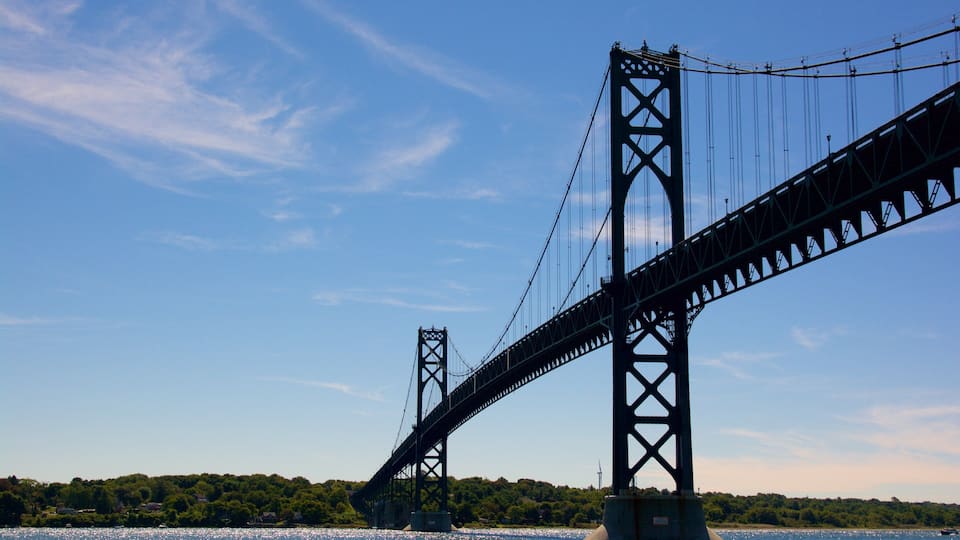 A large suspension bridge with two towers and cables spanning a body of water.