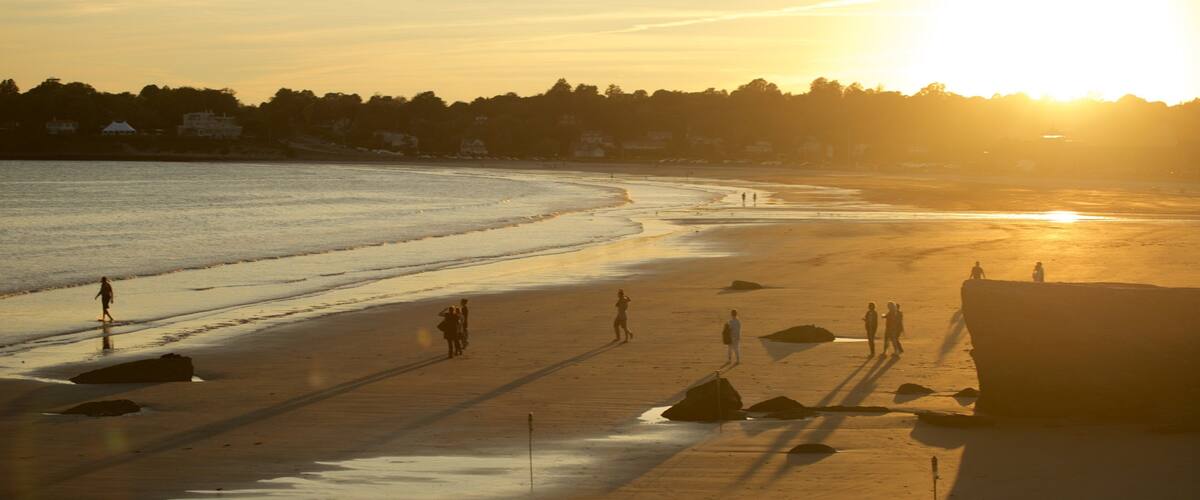 Easton\'s Beach which includes a sunset and a beach