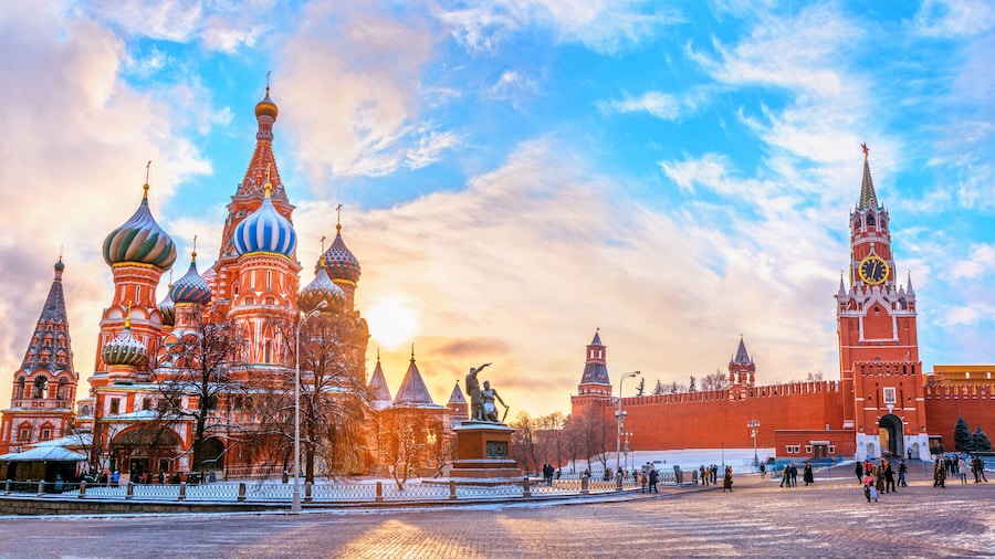 View of the Moscow Kremlin and Cathedral of St. Basil at the Red Square at sunset winter in Moscow, Russia