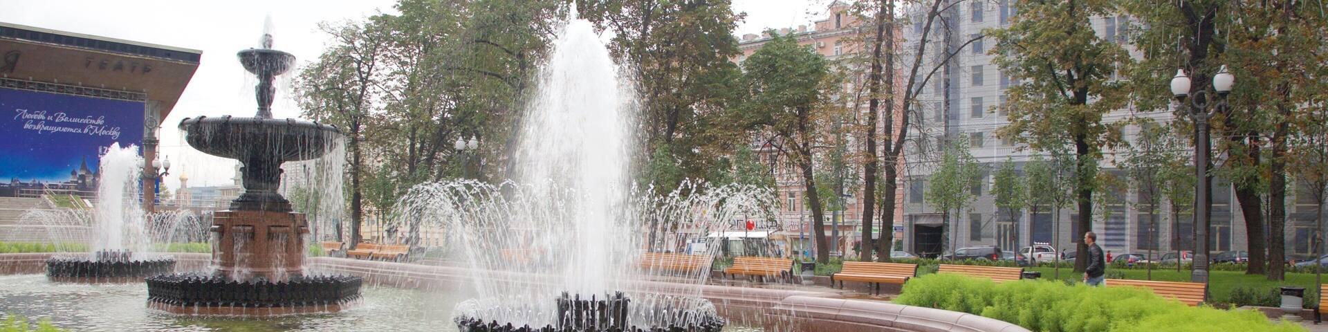Pushkin Square featuring a garden and a fountain