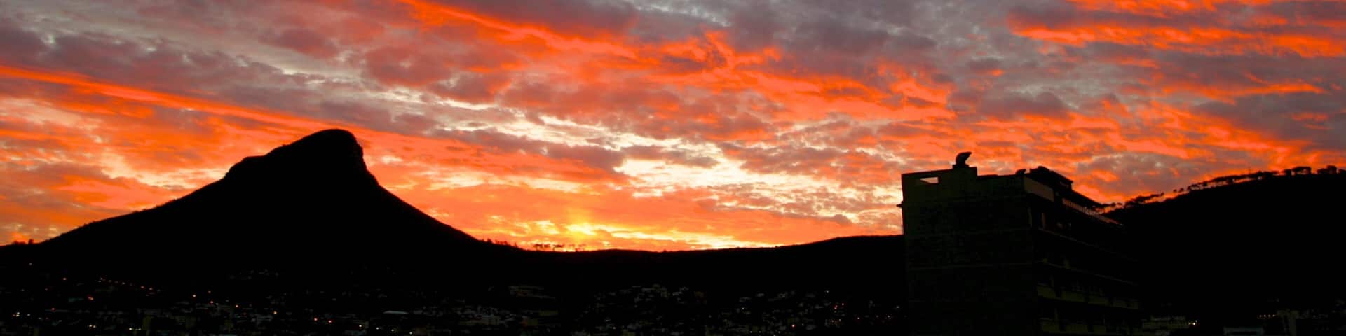 Table Mountain showing a sunset and mountains