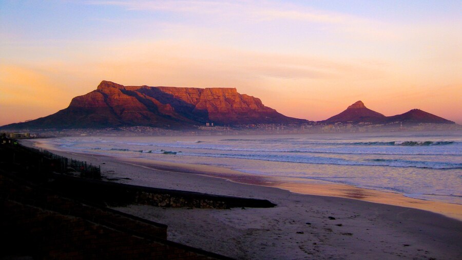 Table Mountain showing a sunset, mountains and a beach