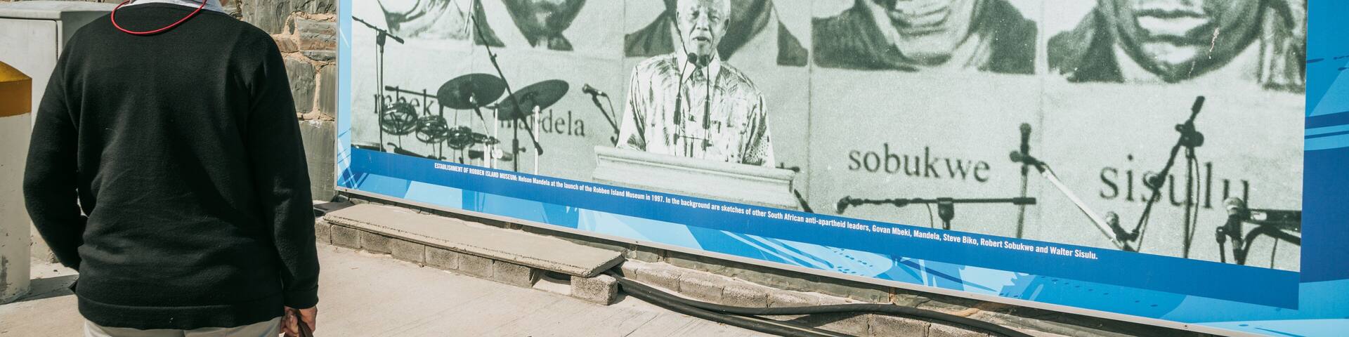 A historical mural with portraits of anti-apartheid leaders.