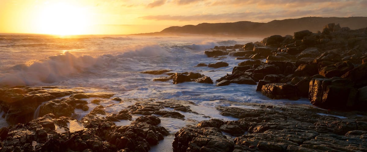 Capo di Buona Speranza mostrando surf e spiaggia di ciottoli