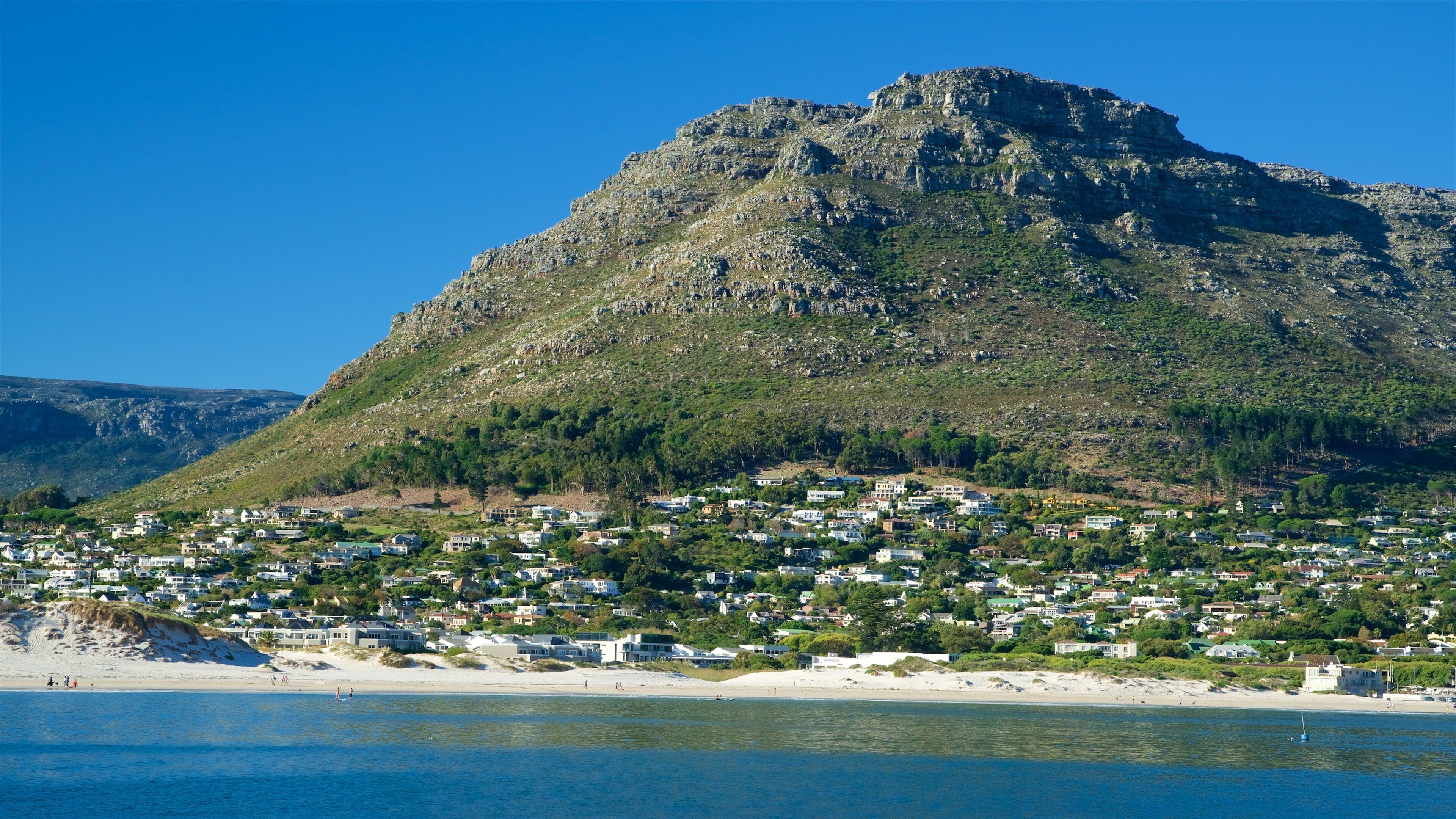 Hout Bay Beach featuring a coastal town and a beach