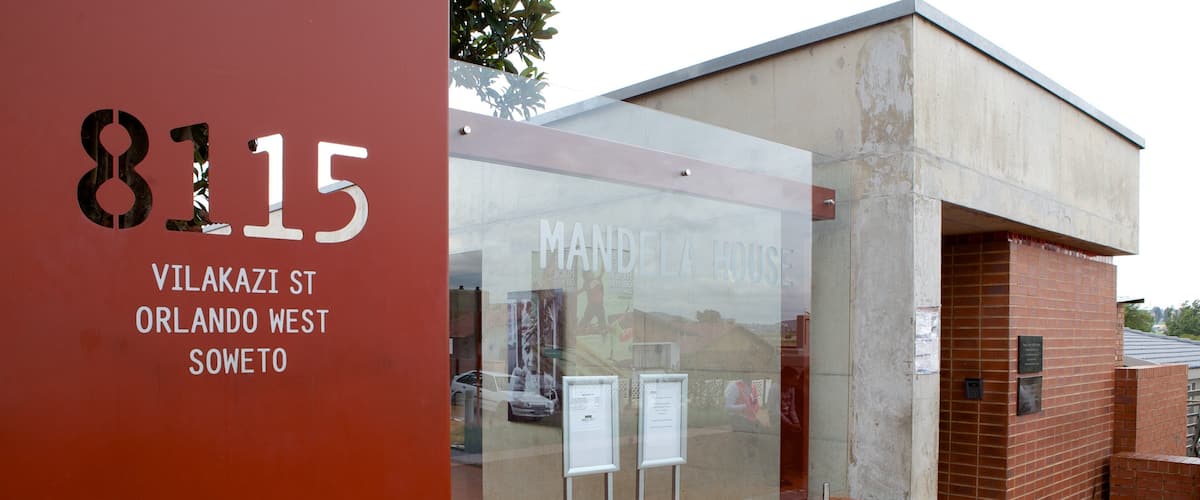 Mandela House which includes signage and a city