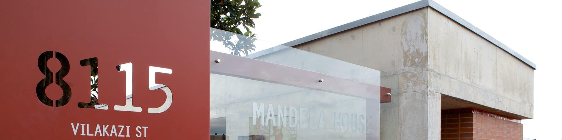 Mandela House which includes a city and signage