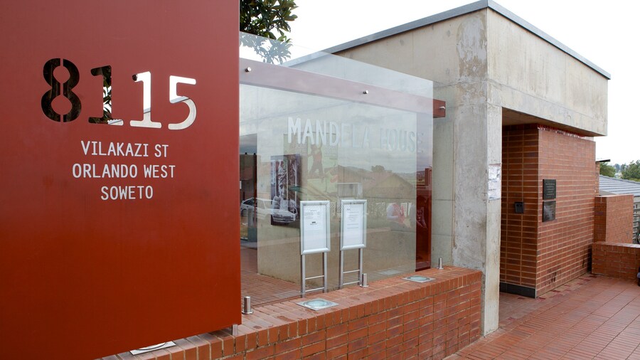 Mandela House which includes signage and a city