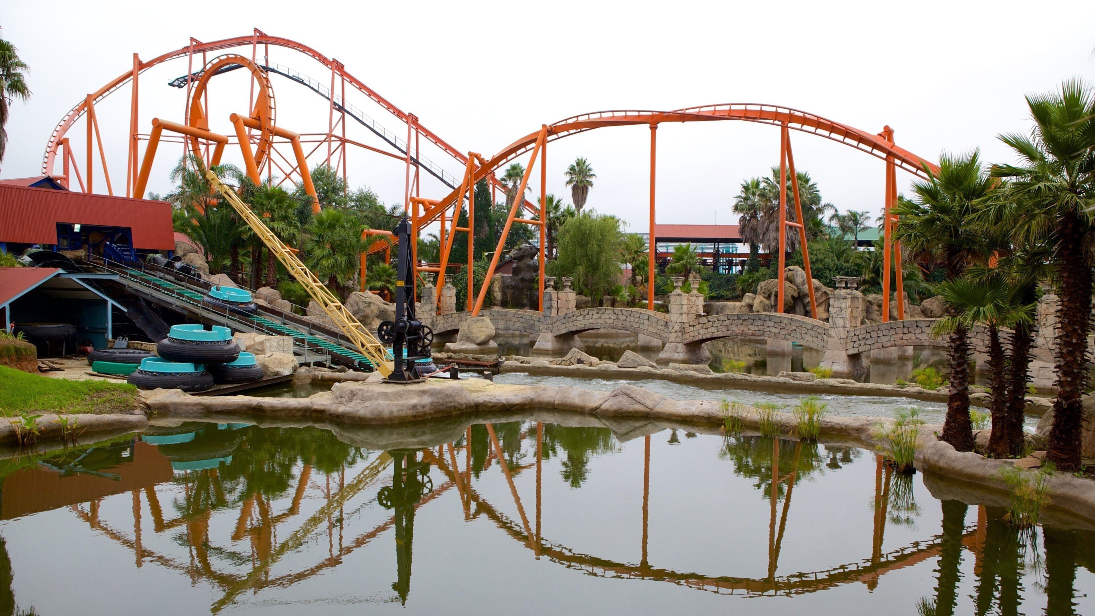 Gold Reef City featuring a pond, rides and a waterpark