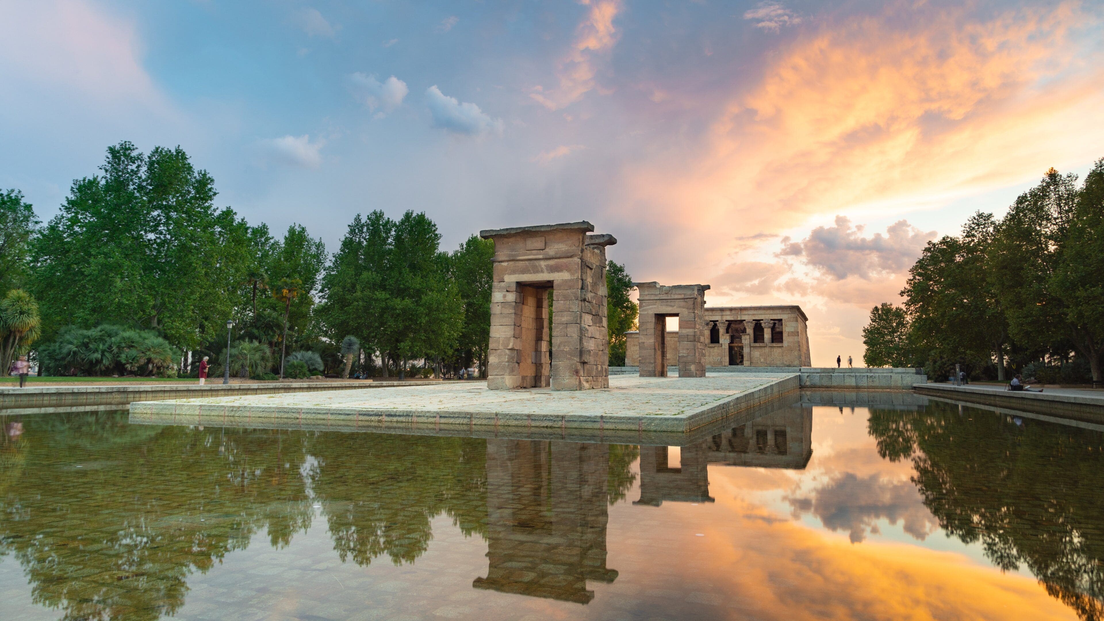 Temple of Debod featuring a fountain, a sunset and a temple or place of worship