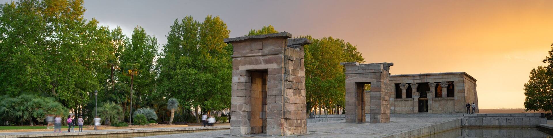 Temple of Debod showing a sunset, a temple or place of worship and a fountain