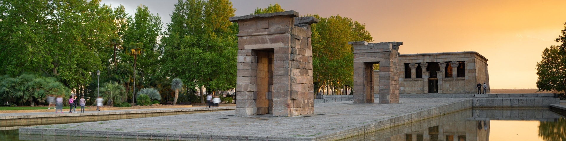 Temple of Debod showing a sunset, a temple or place of worship and a fountain