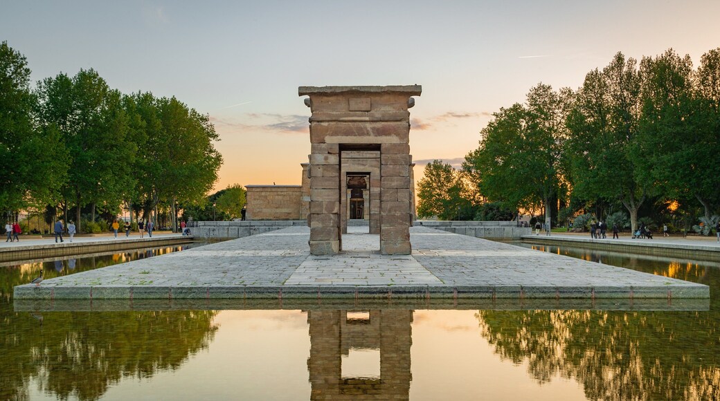 Temple of Debod showing a fountain, a temple or place of worship and a sunset