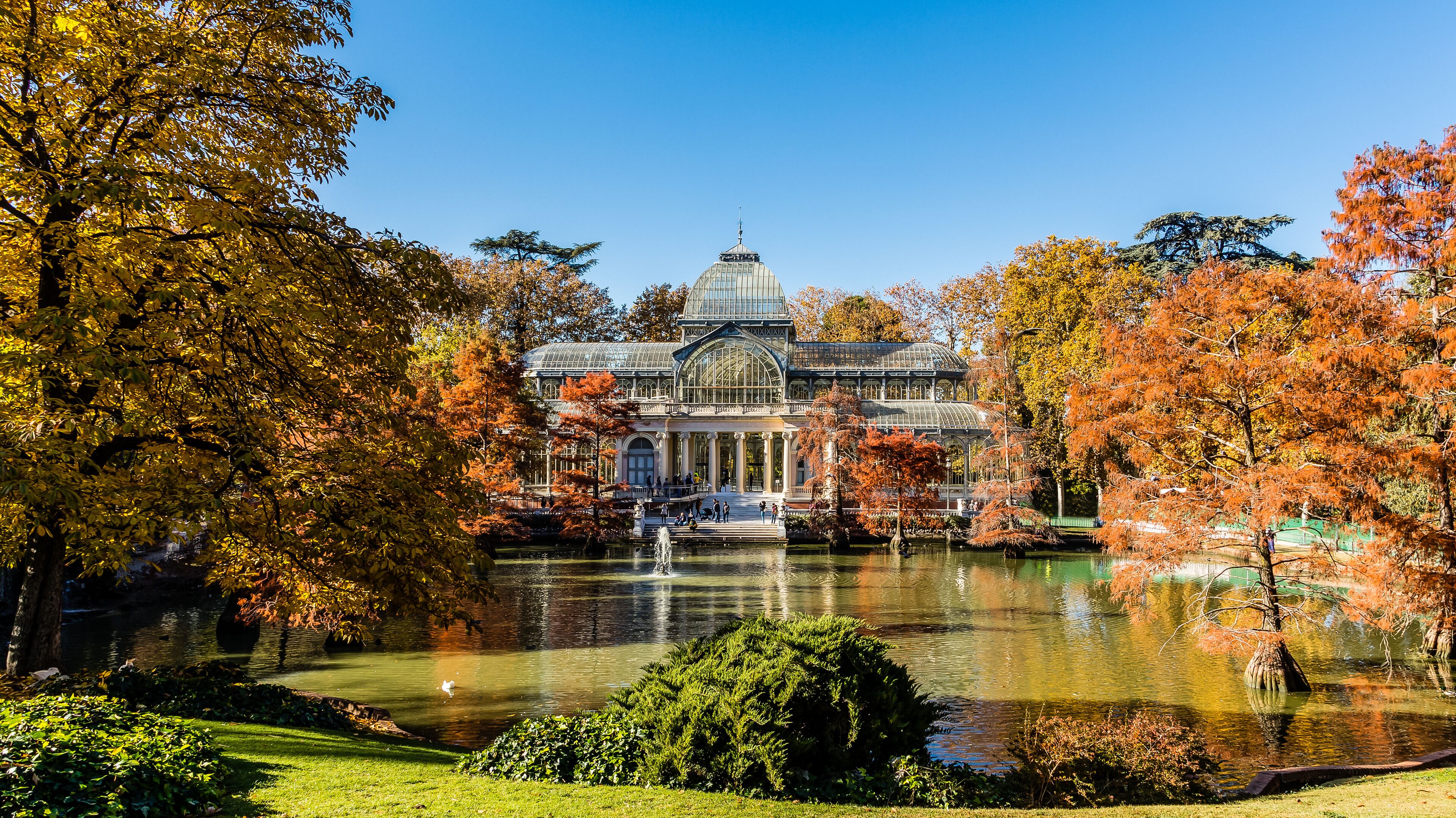 Palacio de Cristal in the Retiro Park in Madrid, surrounded by autumn colors