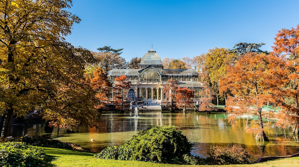 Palacio de Cristal in the Retiro Park in Madrid, surrounded by autumn colors