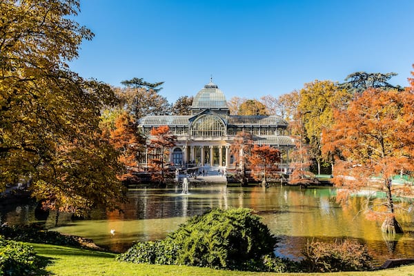 Palacio de Cristal in the Retiro Park in Madrid, surrounded by autumn colors