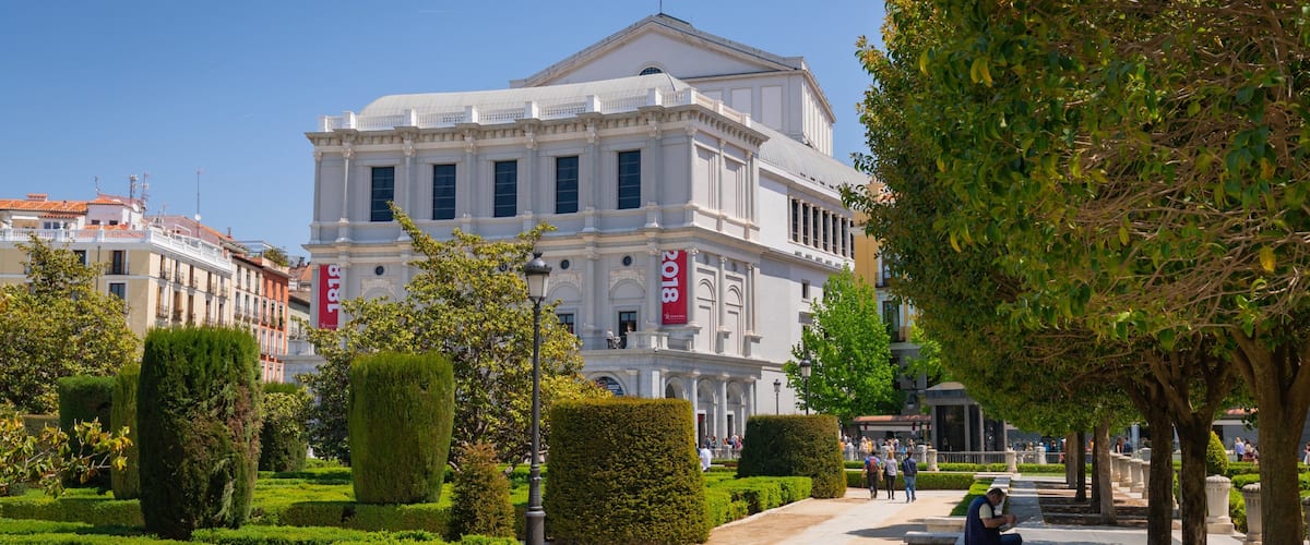 Plaza de Oriente which includes a park and heritage architecture