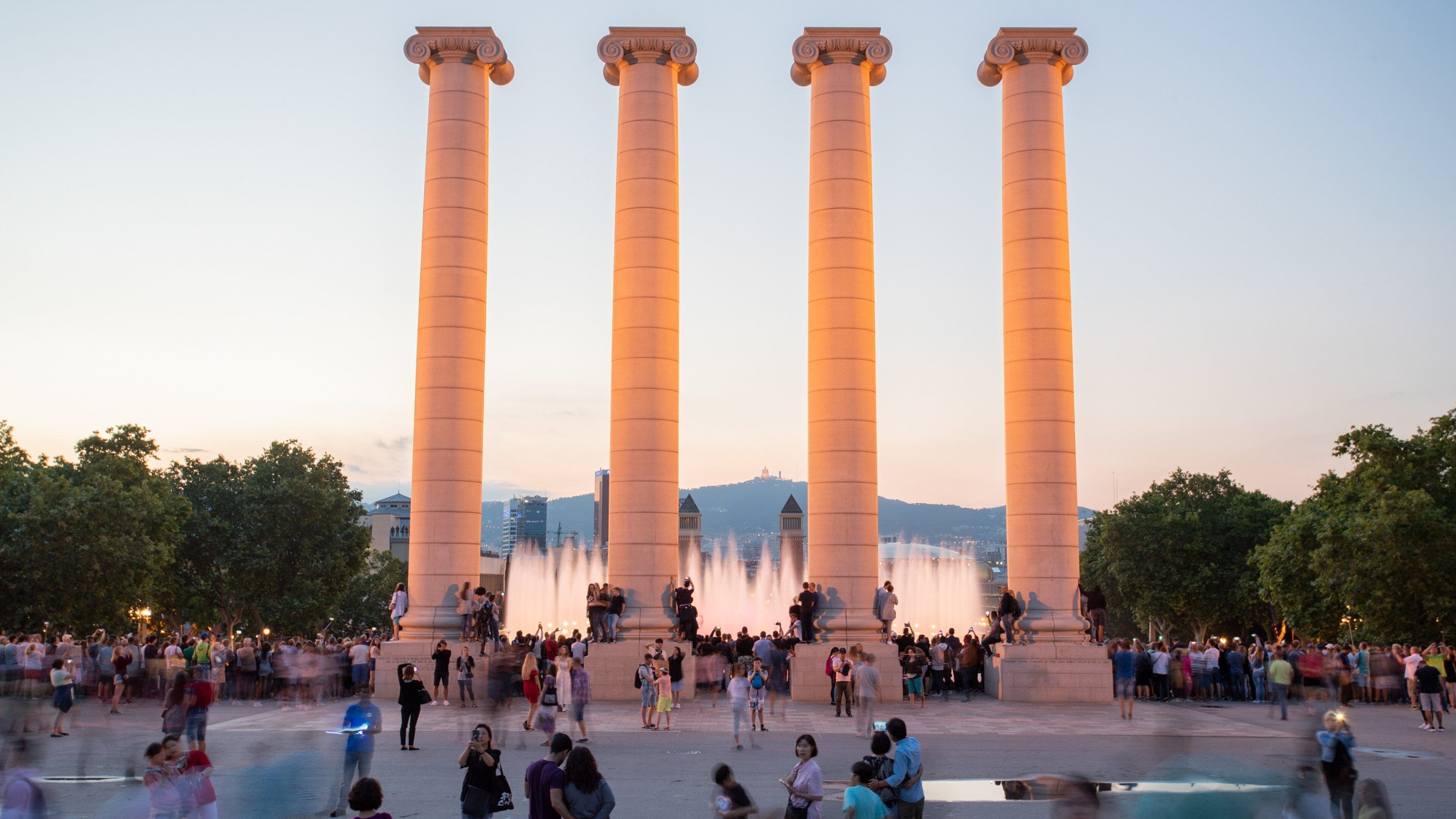 National Art Museum of Catalonia showing a square or plaza, a fountain and a sunset