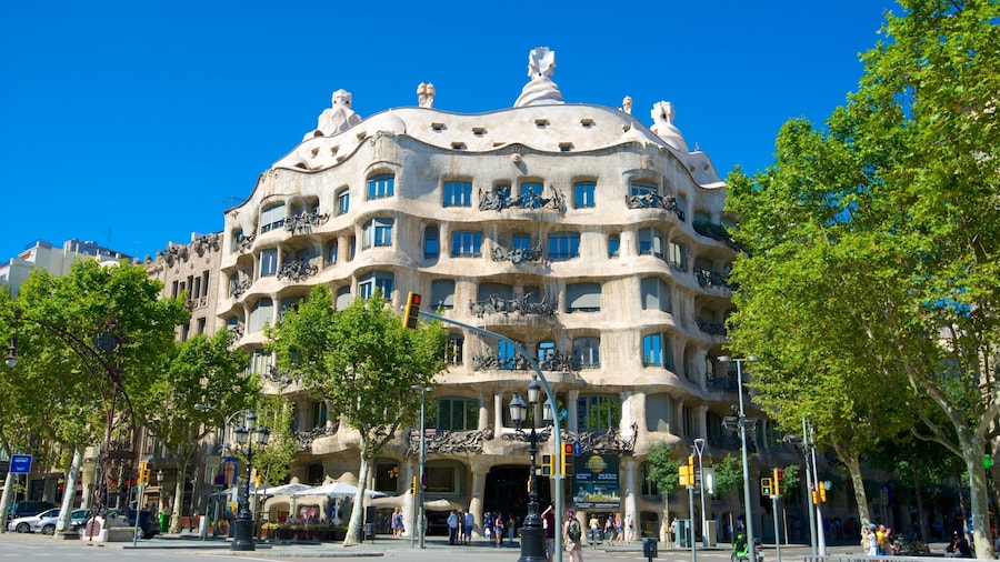 Exterior view of Casa Milà in Barcelona, featuring its undulating stone facade.