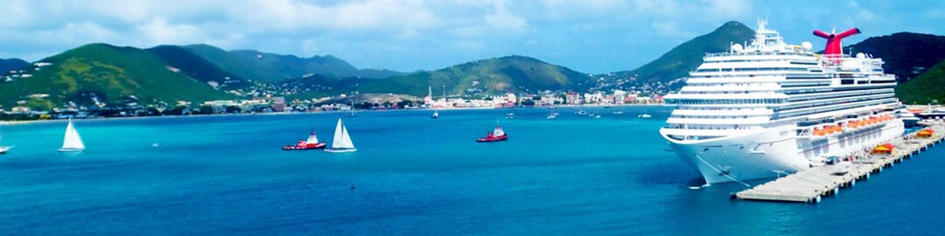The Port of St Maarten is one of the most beautiful ports in the Caribbean. It is also one of the few ports in the region that can accommodate the Harmony of the Sea, which is currently the largest cruise ship in the world. 
Check out our visit to St Maarten:
http://travelwith2ofus.com/visiting-and-touring-st-maarten-st-martin-dutch-and-french-sides-in-one-day.php
Check out the most beautiful cruise ship ports in the #Caribbean: http://travelwith2ofus.com/the-most-beautiful-cruise-ship-ports-in-the-caribbean.php
#Cruise #StMaarten #Cruiseship #travel #SintMarteen #MahoBeach #Dutch #French #SImpsonBay #Lagoon #Marigot #Philipsburg #Blue