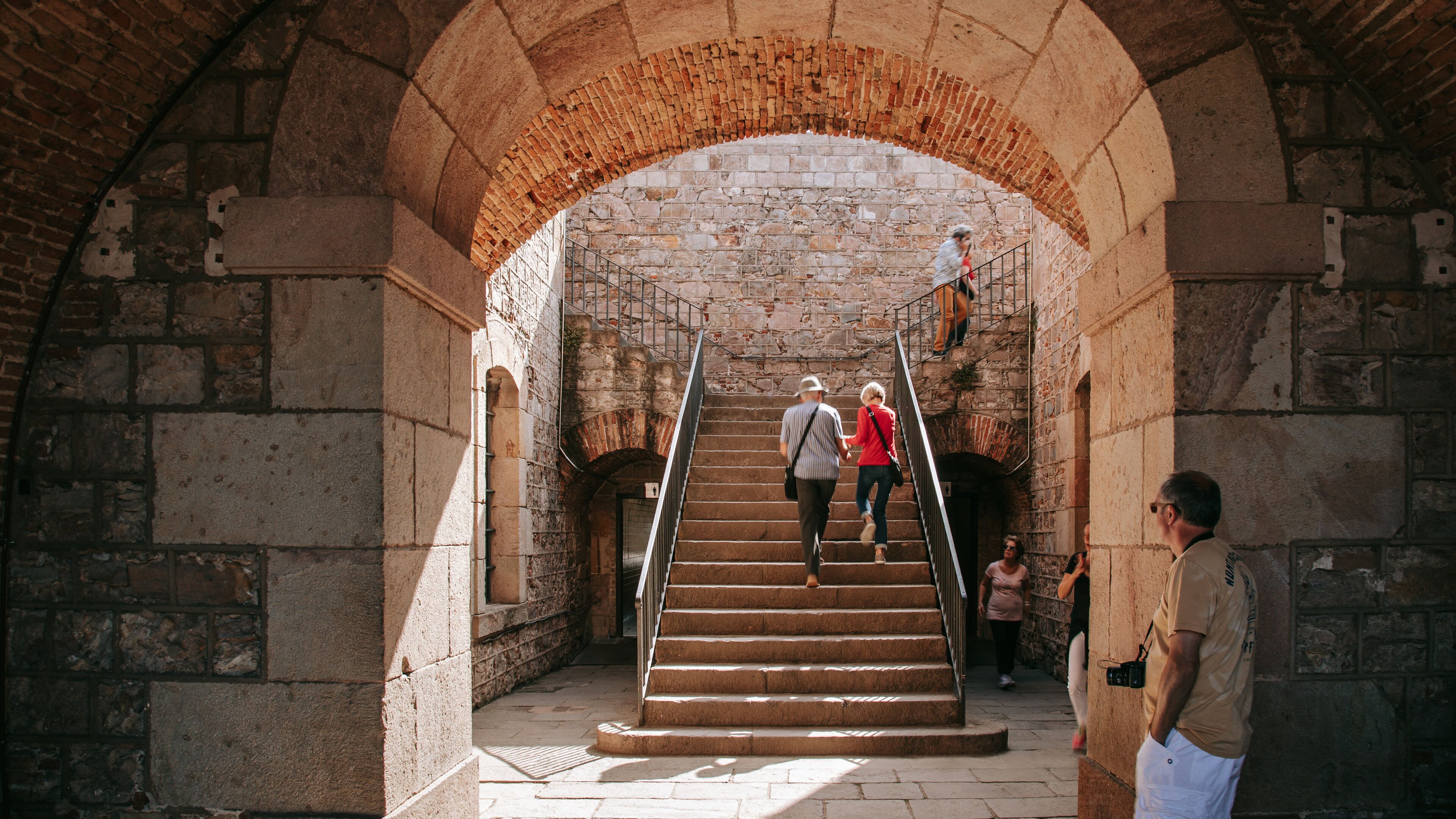Montjuic Castle showing heritage elements as well as a couple