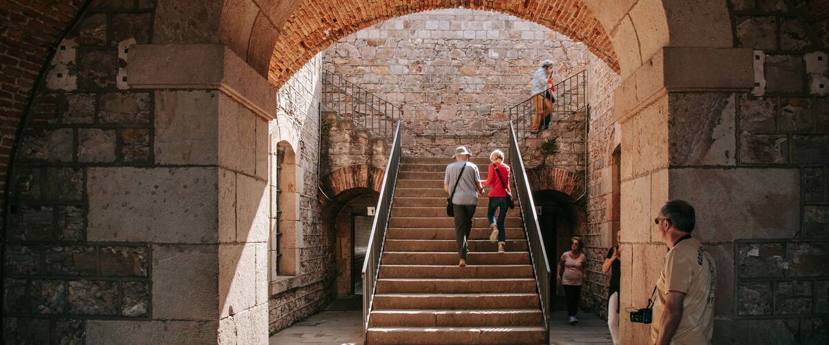 Montjuic Castle showing heritage elements as well as a couple