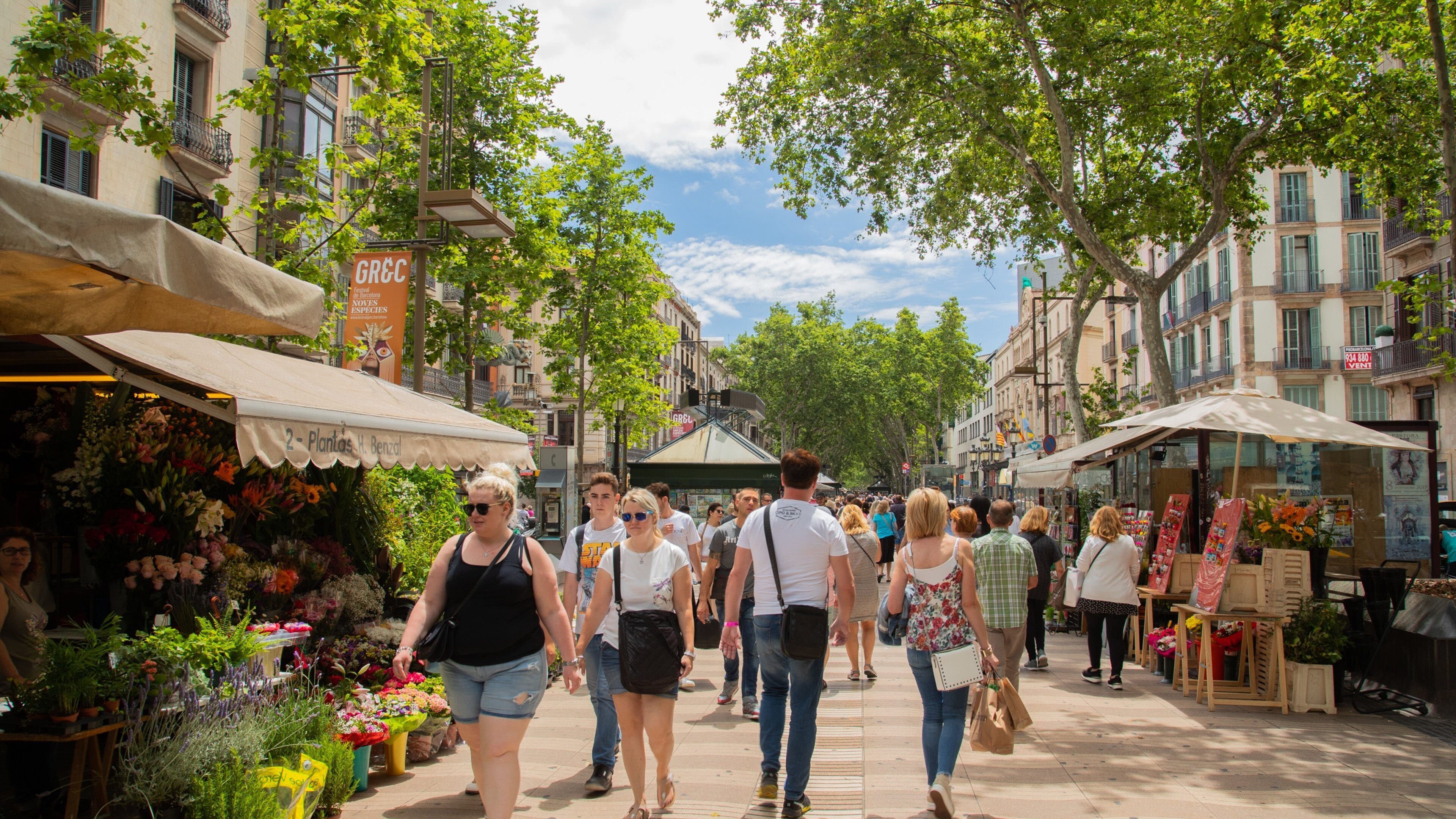Las Ramblas showing markets and street scenes as well as a small group of people