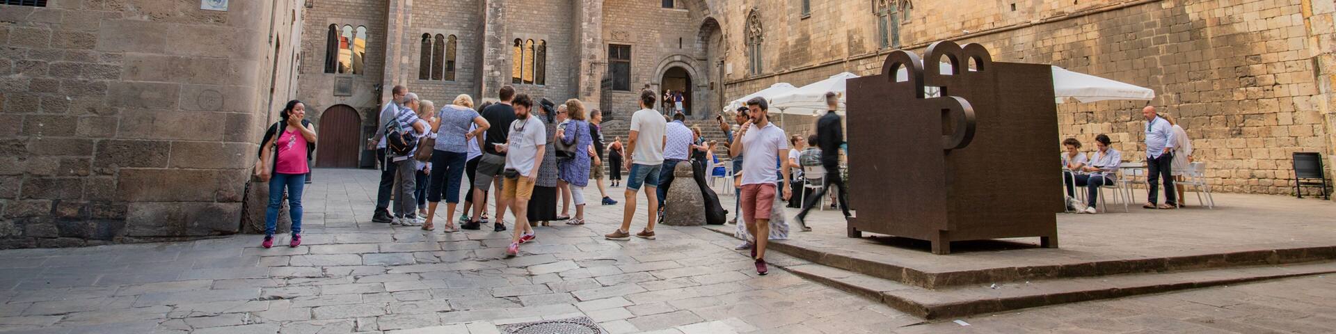 Placa del Rei featuring heritage elements and street scenes as well as a small group of people