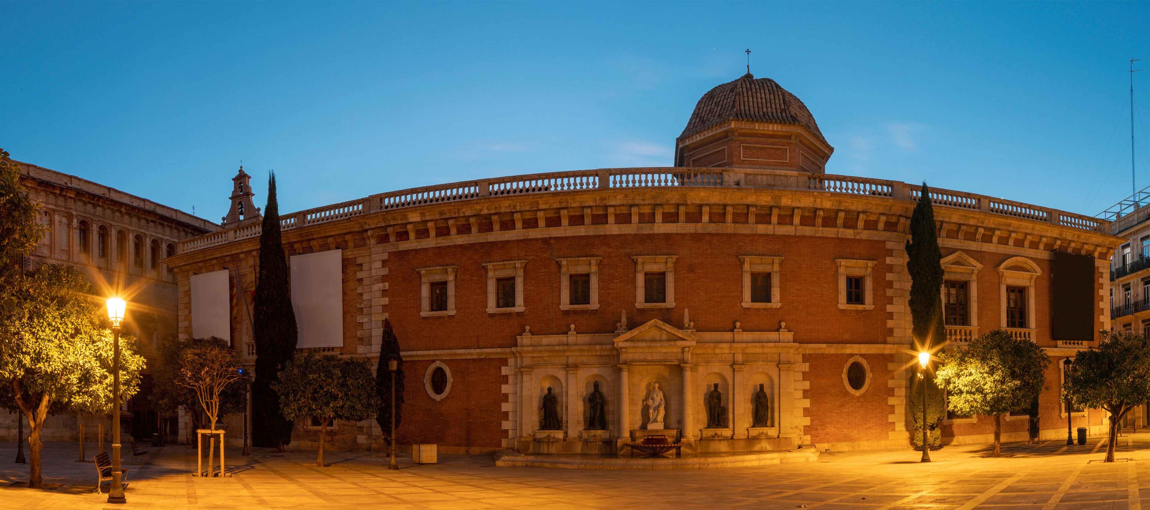 Valencia - The panorama of historic University builiding with the square at dusk.