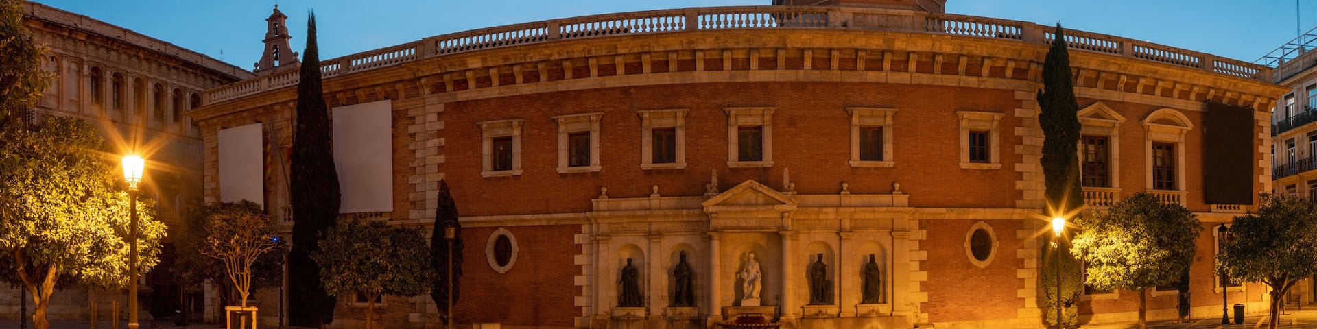 Valencia - The panorama of historic University builiding with the square at dusk.