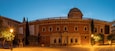 Valencia - The panorama of historic University builiding with the square at dusk.