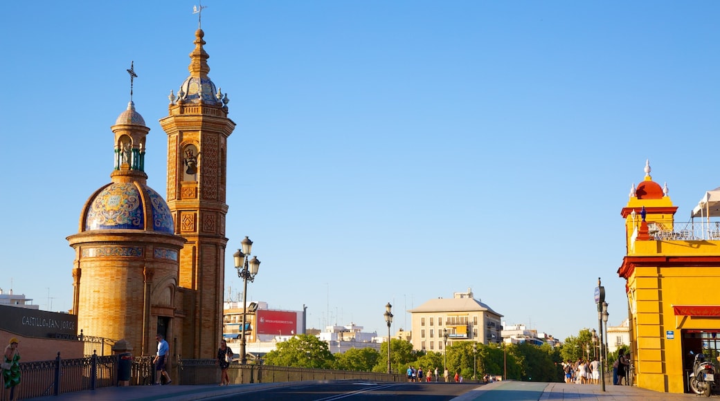 Triana Bridge featuring a bridge, a church or cathedral and street scenes
