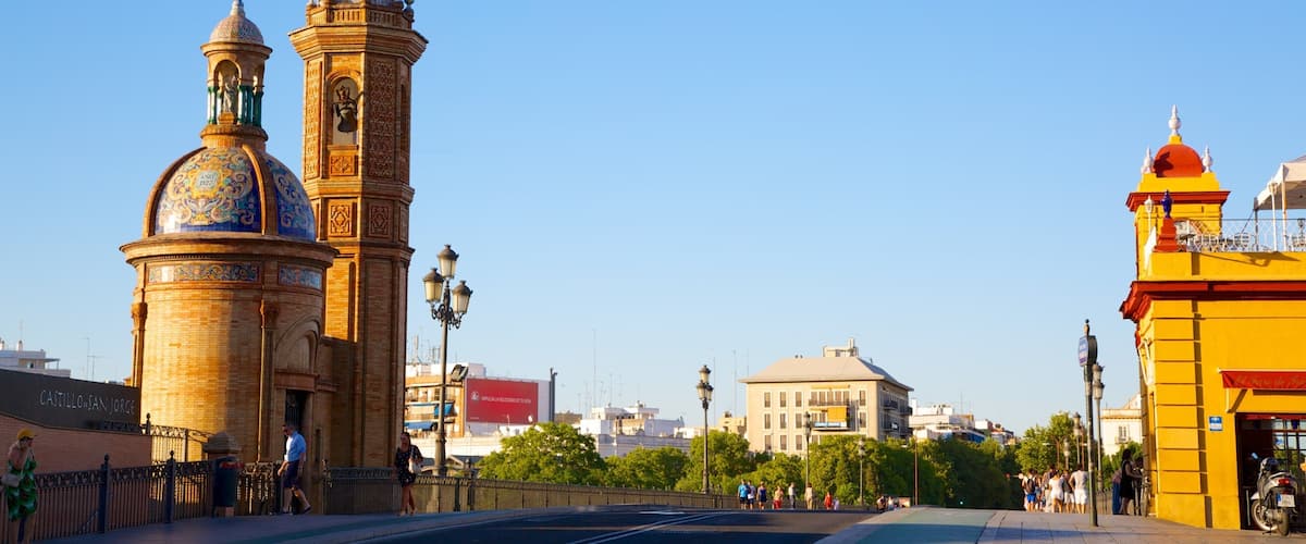 Triana Bridge featuring a bridge, a church or cathedral and street scenes