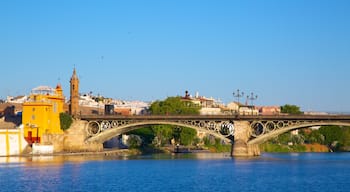 Triana Bridge featuring a city, a river or creek and a bridge