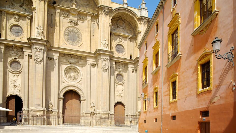 A historic building with ornate facades, large arched doorways, and detailed sculptures.
