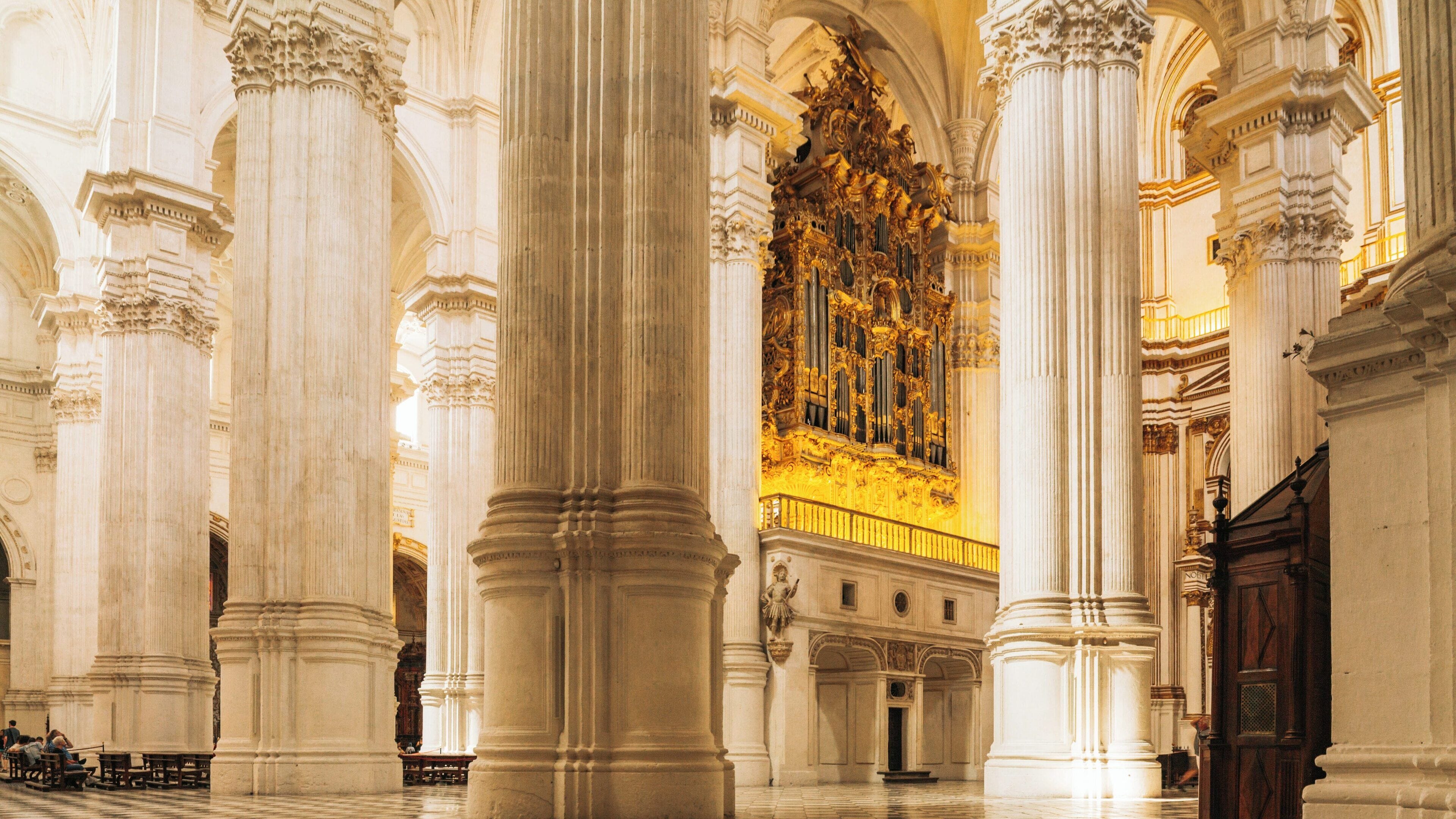 Granada Cathedral interior in Centro District showcasing intricate architecture and golden altar in Andalusia, Spain